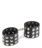Menottes poignets cuir noir rivets